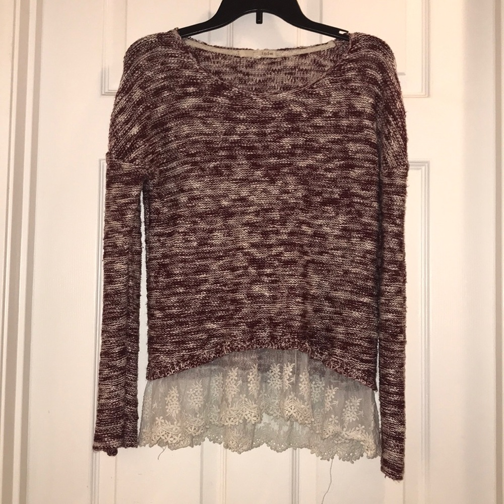 Sweater color is maroon with cream lace